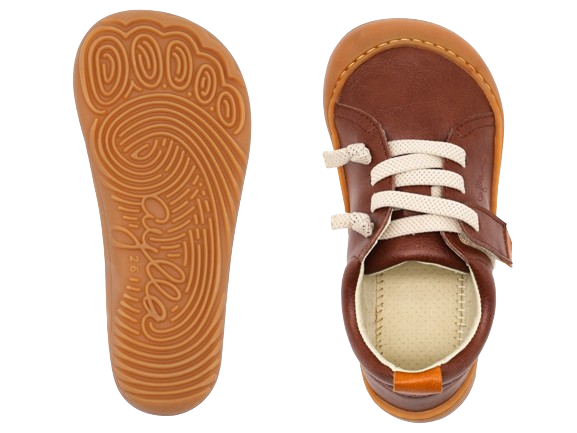 Top and bottom of kids barefoot shoe of brown color.