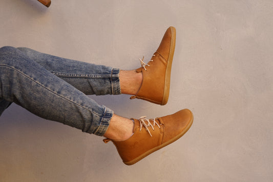 Realistic photo of sand color high-cut barefoot shoes