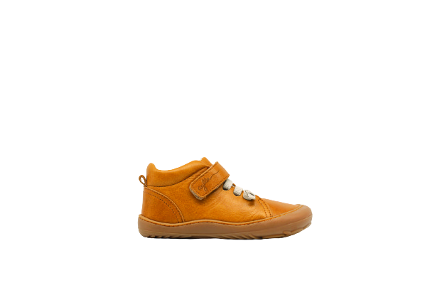 Side of kid's barefoot shoe sand color.