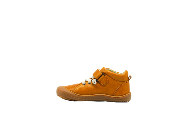 Side of kid's barefoot shoe sand color.