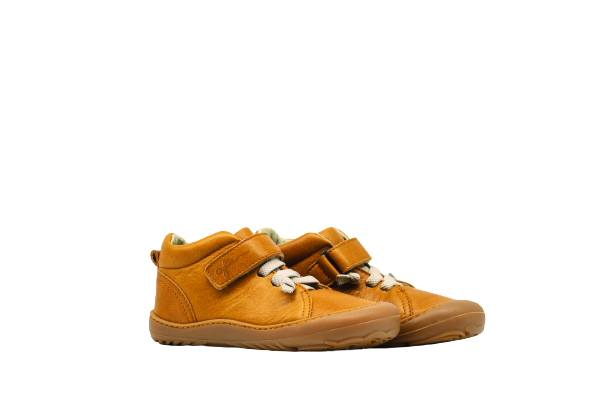 Side of kid's barefoot shoes sand color.