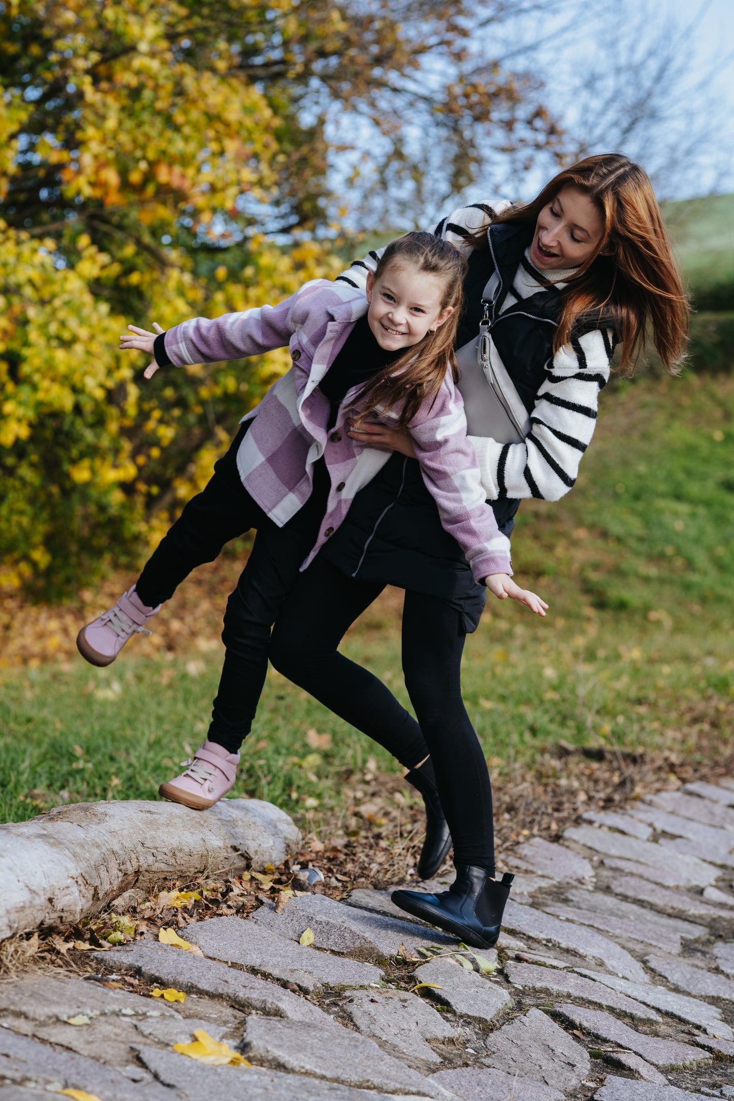 Mum and girl wearing kid's pink barefoot shoes
