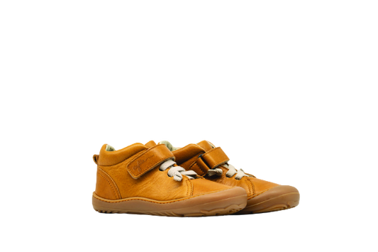 Side of kid's barefoot shoes sand color.