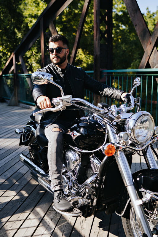 Man on motorbike wearing Black high-cut barefoot shoes